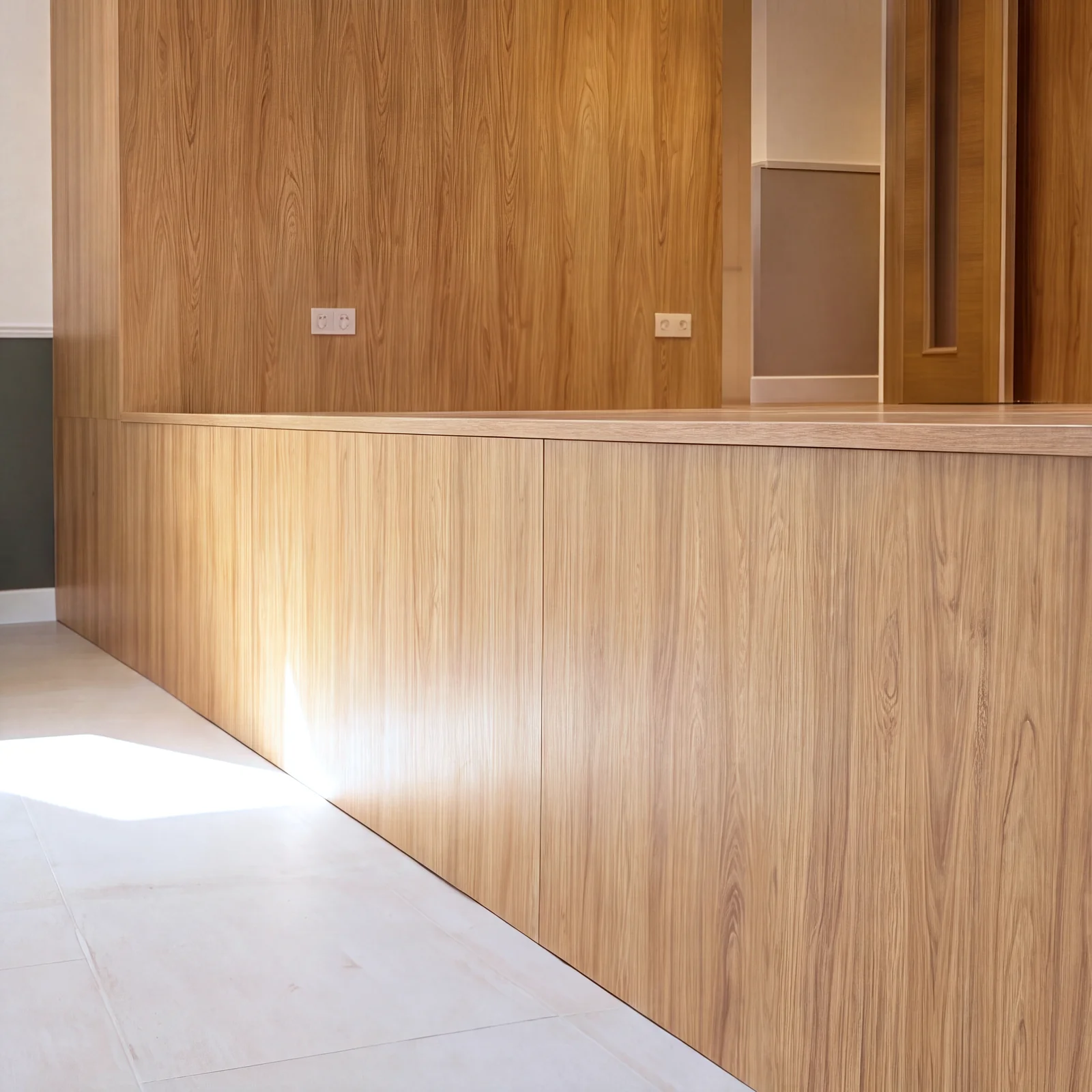 Oak-clad stage front with a lit oak-panelled wall behind