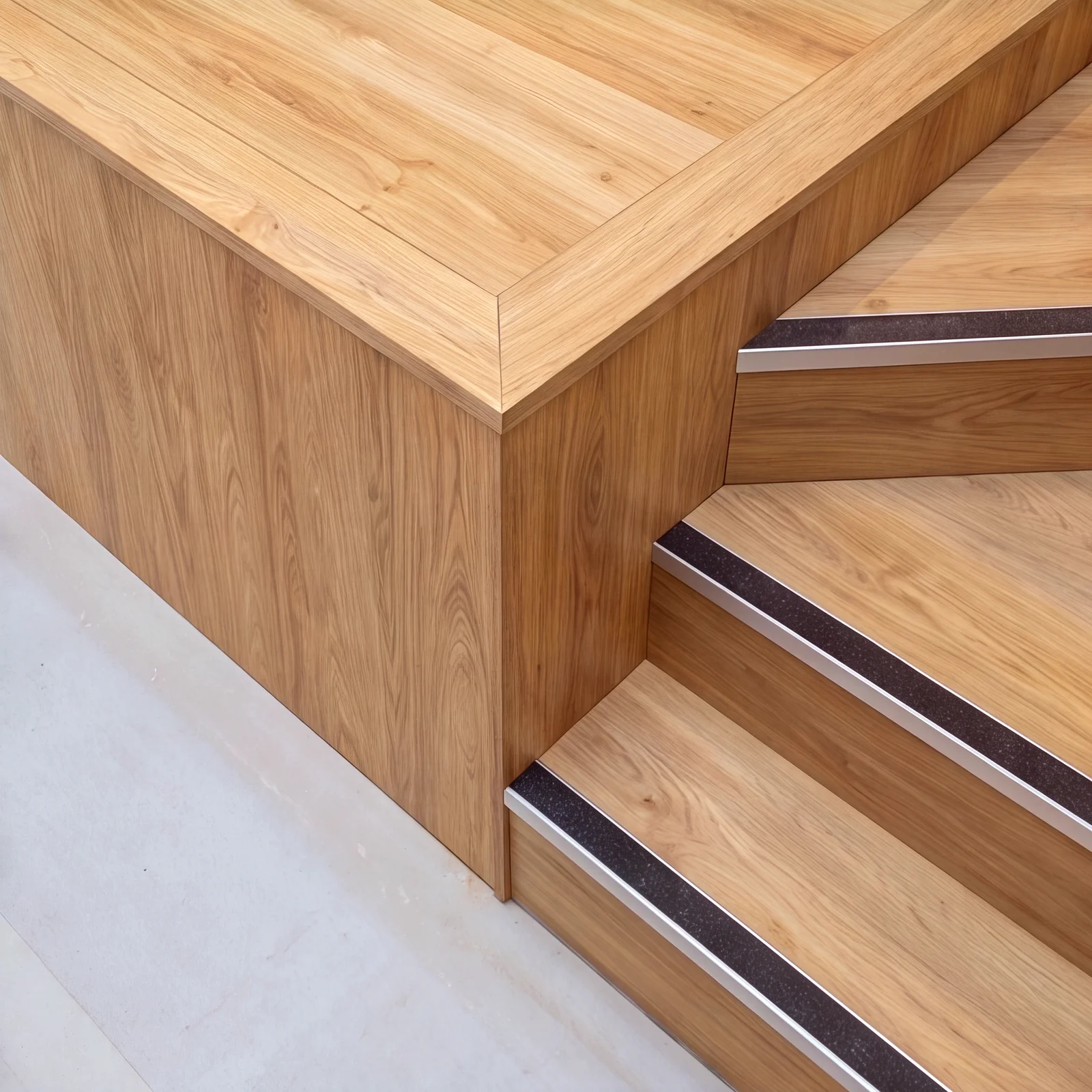 Close-up of oak stage steps with dark anti-slip nosings